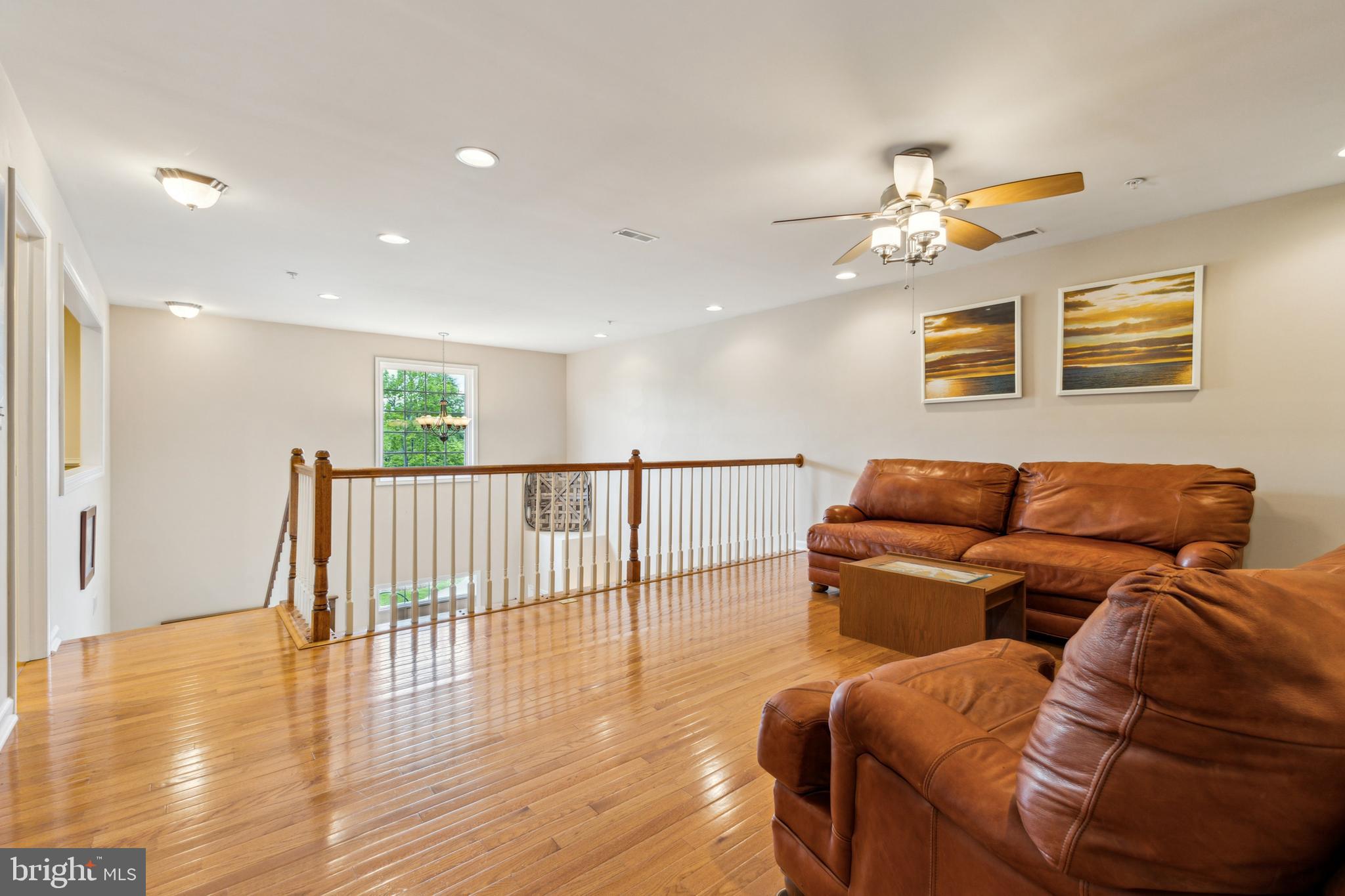 633 Ruxton Road, Unit 75 Solomons, MD 20629 - Photo 27 of 43 a living room with furniture and wooden floor