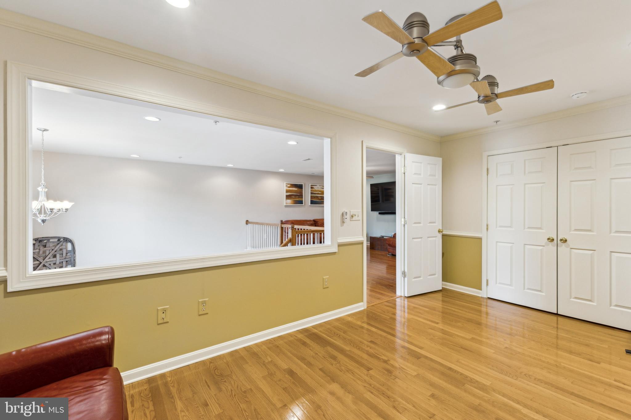 633 Ruxton Road, Unit 75 Solomons, MD 20629 - Photo 31 of 43 a view of a kitchen with wooden floor and a ceiling fan