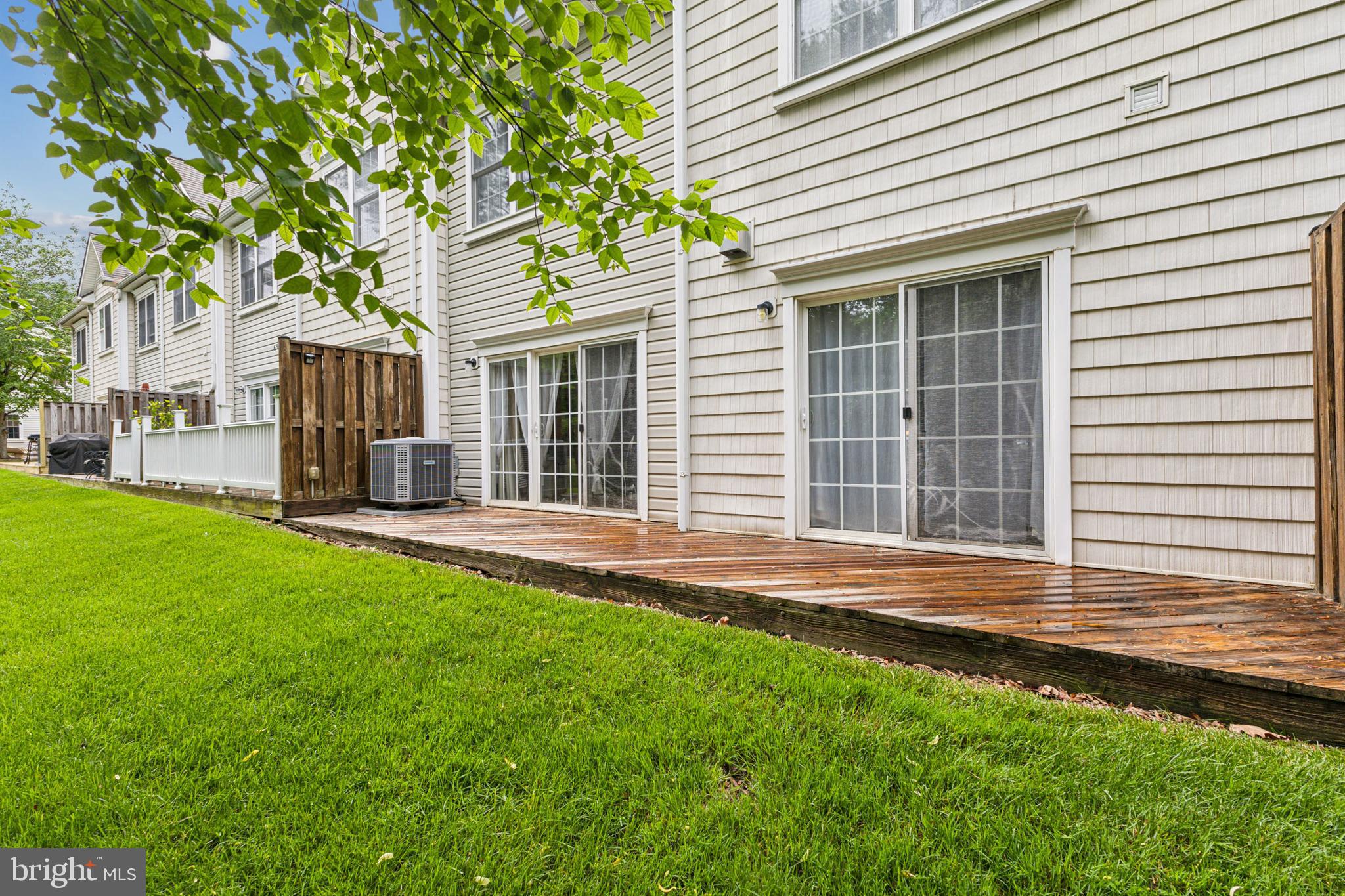 633 Ruxton Road, Unit 75 Solomons, MD 20629 - Photo 39 of 43 a front view of a house with a garden and yard