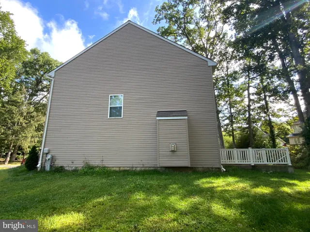 a house view with a backyard space
