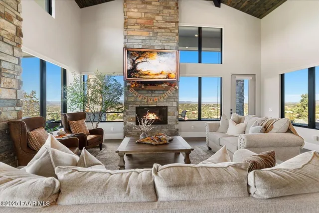 a kitchen with kitchen island granite countertop a sink stainless steel appliances and cabinets