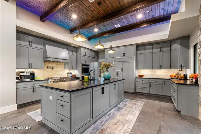 a kitchen with table and chairs
