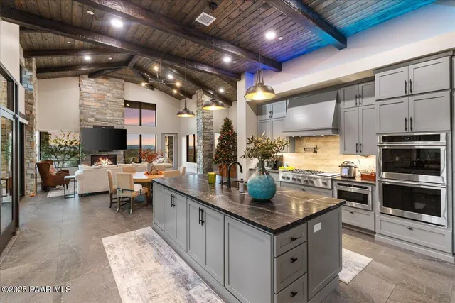 a dining room with furniture a fireplace and window