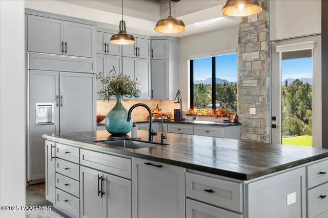 a bathroom with a double vanity sink toilet and shower