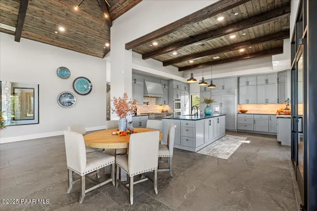 a view of a house with a yard balcony and furniture
