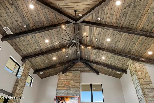 a view of a house with a big yard and large trees