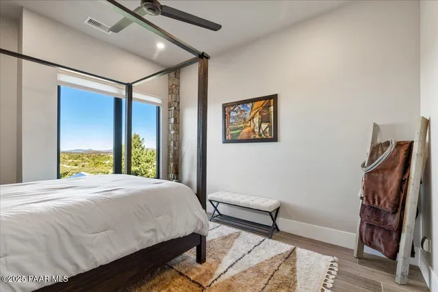 a spacious bedroom with a bed and a fireplace