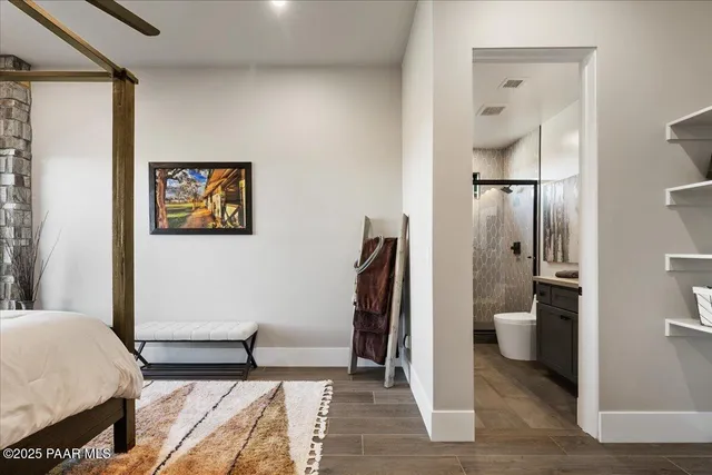 a bed sitting in a bedroom next to a fireplace