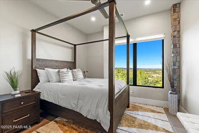 a balcony with couch and wooden floor