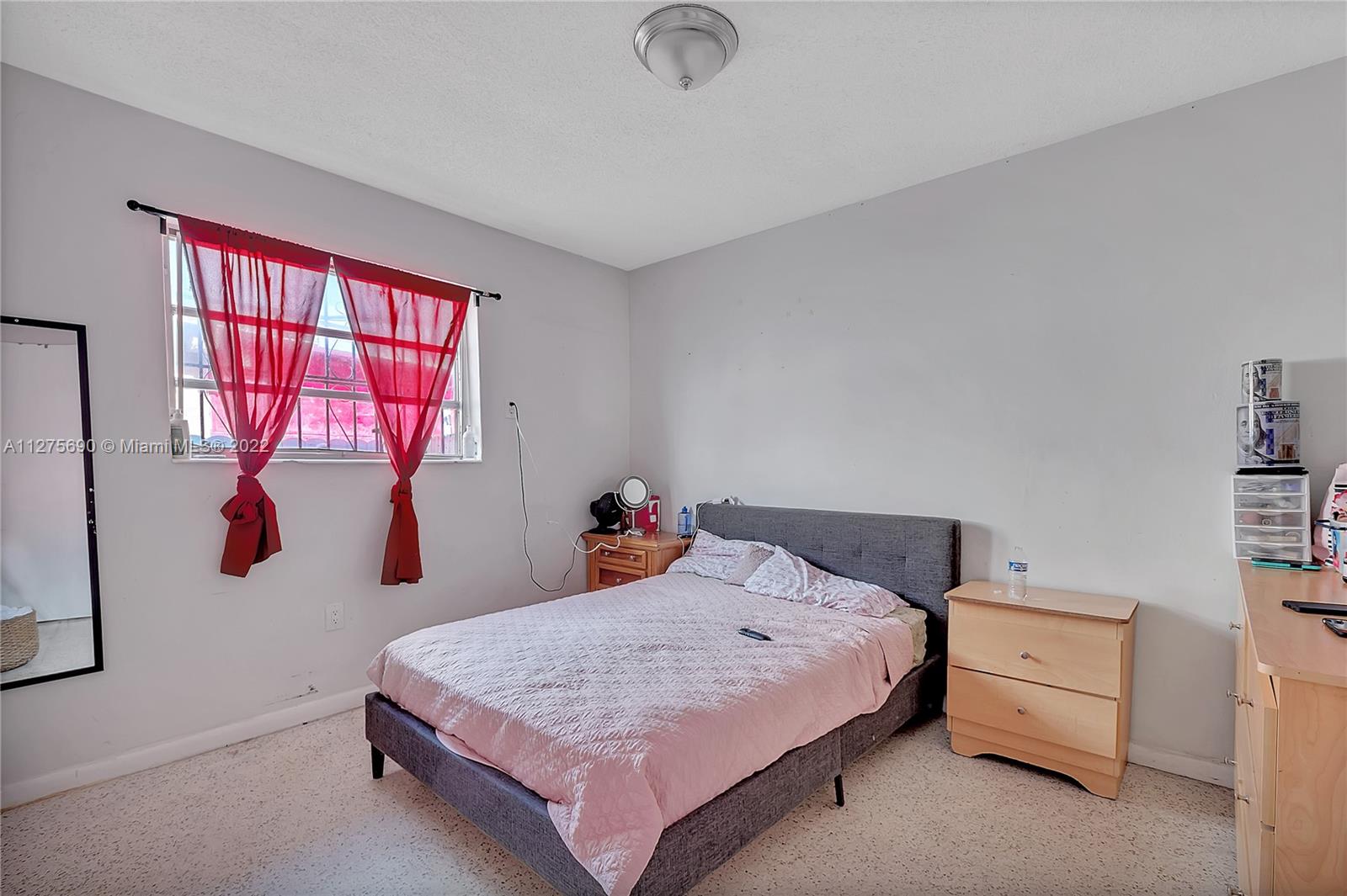 Allapattah Miami, FL 33142 - Photo 8 of 31 a bedroom with a bed and a dresser