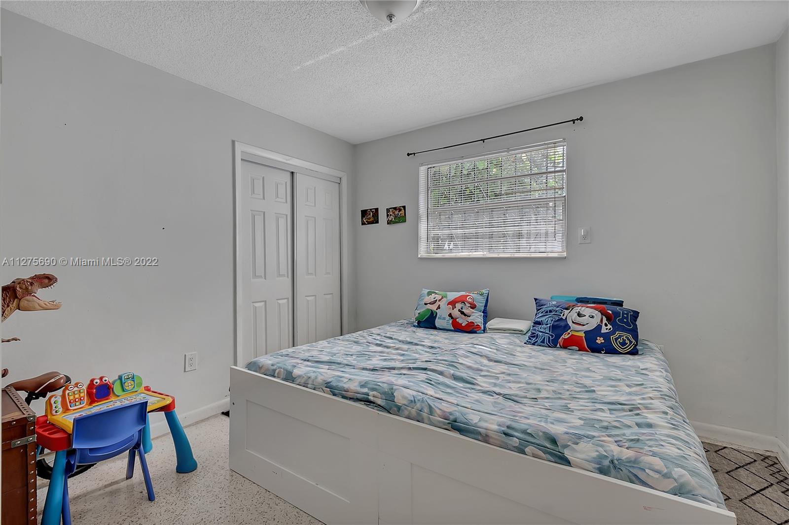 Allapattah Miami, FL 33142 - Photo 10 of 31 a bedroom with a bed and a window