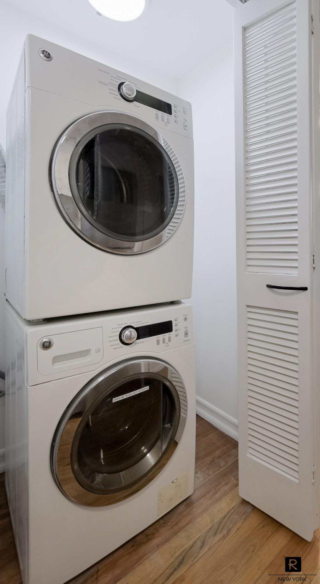 407 East 12th Street, Unit 4FSW Manhattan, NY 10009 - Photo 5 of 16 a utility room with dryer and washer