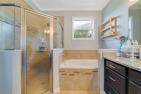 a bathroom with a granite countertop shower mirror and a sink