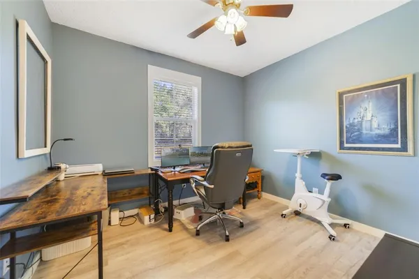 a view of a workspace with furniture