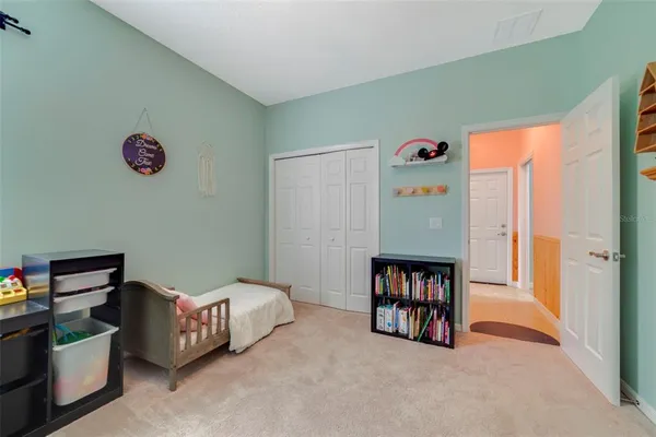 a bedroom with bed and a window