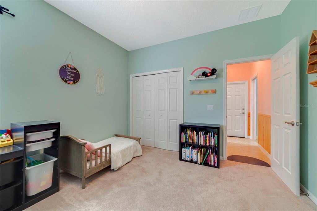 37041 North Thrill Hill Road Eustis, FL 32736 - Photo 18 of 25 a bedroom with bed and a window