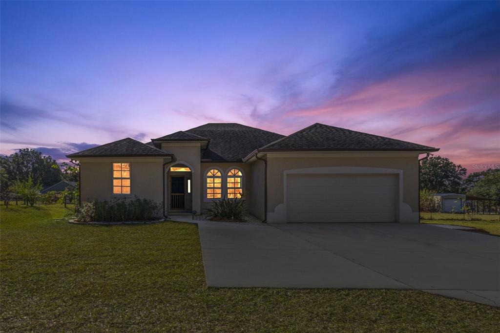 37041 North Thrill Hill Road Eustis, FL 32736 - Photo 25 of 25 a front view of a house with a yard