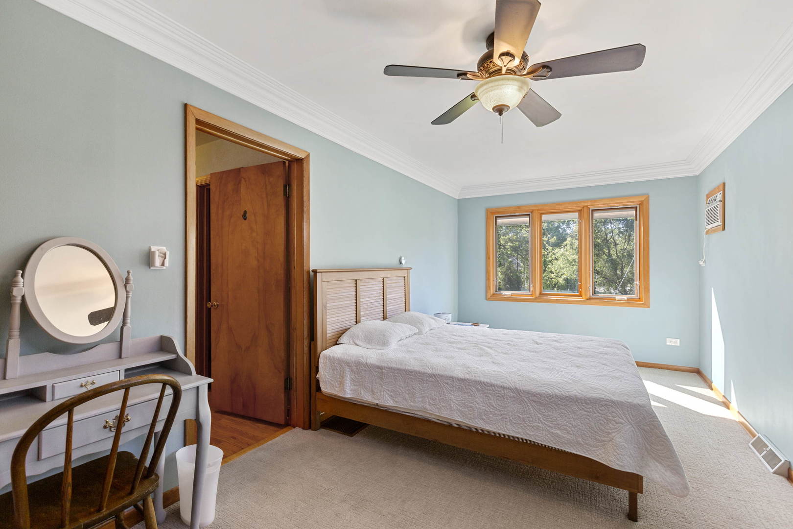 404 Selborne Road Riverside, IL 60546 - Photo 13 of 26 a bedroom with a bed a mirror on the dresser and windows