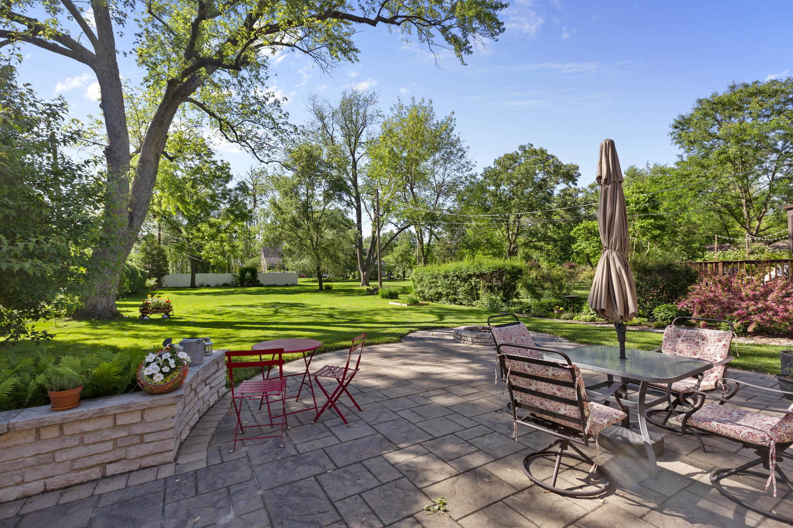 404 Selborne Road Riverside, IL 60546 - Photo 4 of 26 a view of backyard with seating area and green space