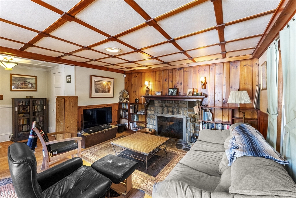 115 Kennedy Road Stoughton, MA 02072 - Photo 15 of 42 a living room with furniture a fireplace and a flat screen tv