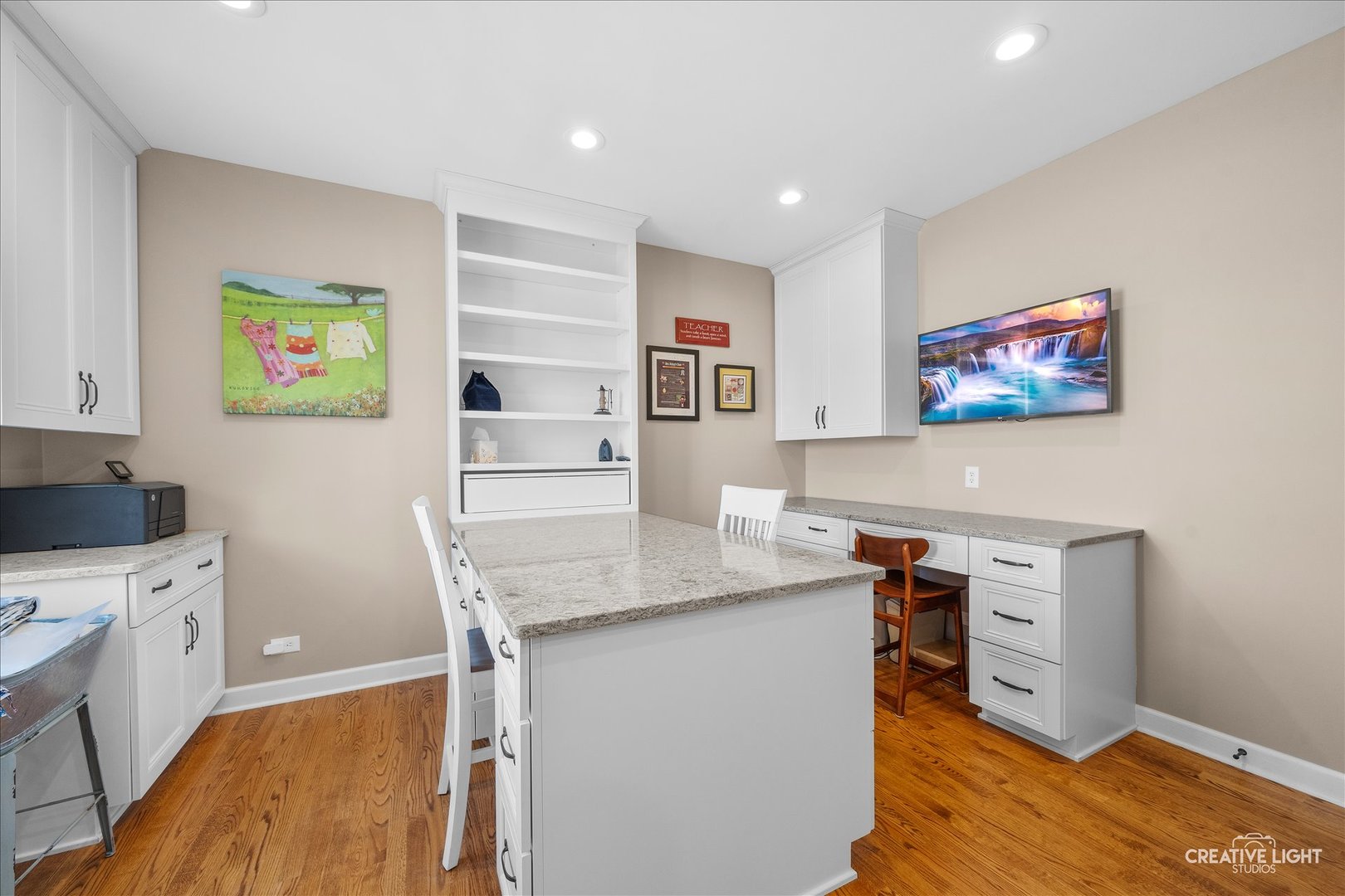 1651 Johnson Road Oswego, IL 60543 - Photo 17 of 60 a view of a workspace with furniture and wooden floor