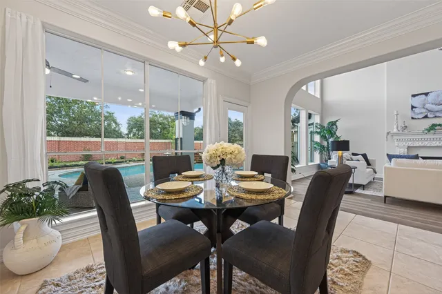 a view of a dining room with furniture window and outside view