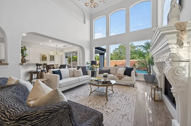 a living room with furniture kitchen view and a table