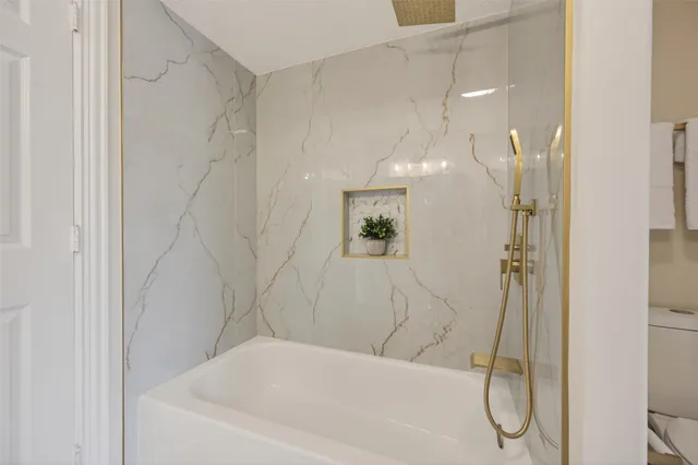 a bathroom with a sink vanity granite and a mirror