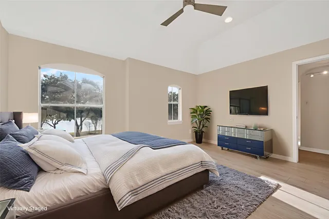 a view of swimming pool with lounge chairs in patio