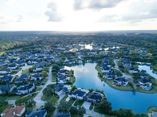 an aerial view of city and lake