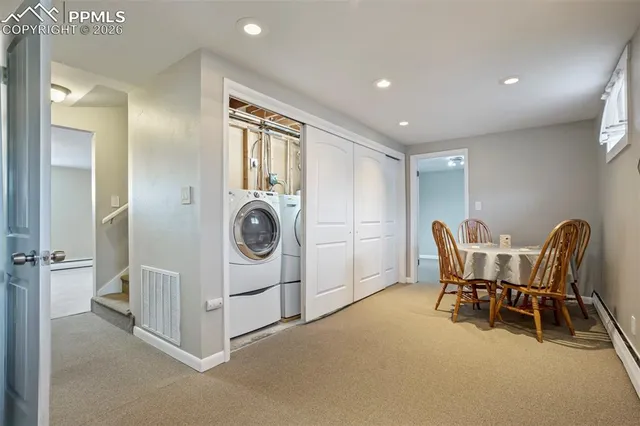 a view of a hallway with seating area