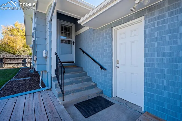 a view of entryway with wooden floor and stairs