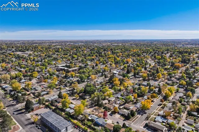 an aerial view of residential house with outdoor space and parking