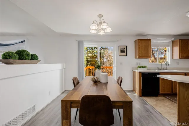 a kitchen with stainless steel appliances a sink stove and refrigerator