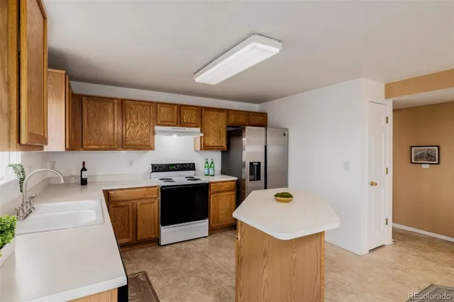 a spacious bedroom with a bed and a window