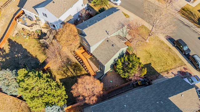 a living room with furniture and flowers