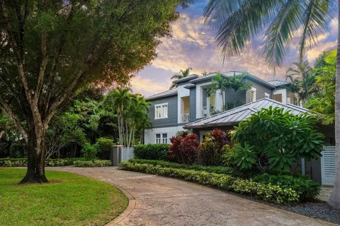front view of a house with a garden