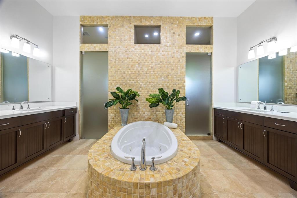 101 Holly Lane Plantation, FL 33317 - Photo 25 of 59 a spacious bathroom with a sink double vanity and a mirror