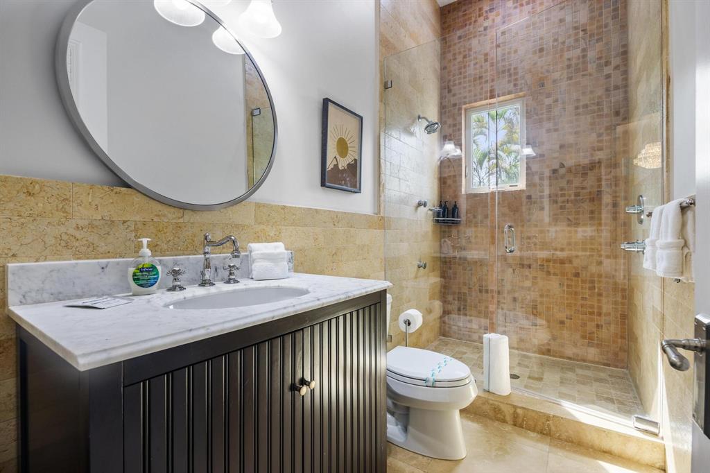 101 Holly Lane Plantation, FL 33317 - Photo 34 of 59 a bathroom with a sink vanity mirror and toilet