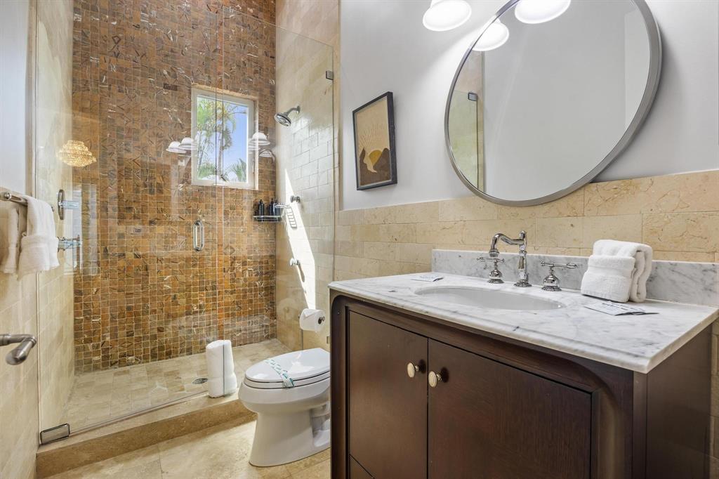 101 Holly Lane Plantation, FL 33317 - Photo 40 of 59 a bathroom with a granite countertop sink a toilet and a mirror