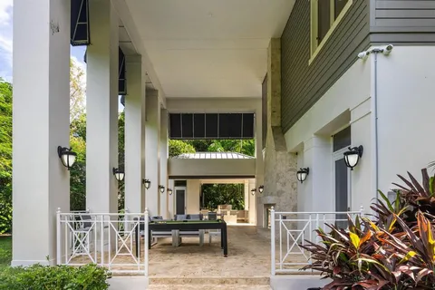 a view of a patio with swimming pool table and chairs