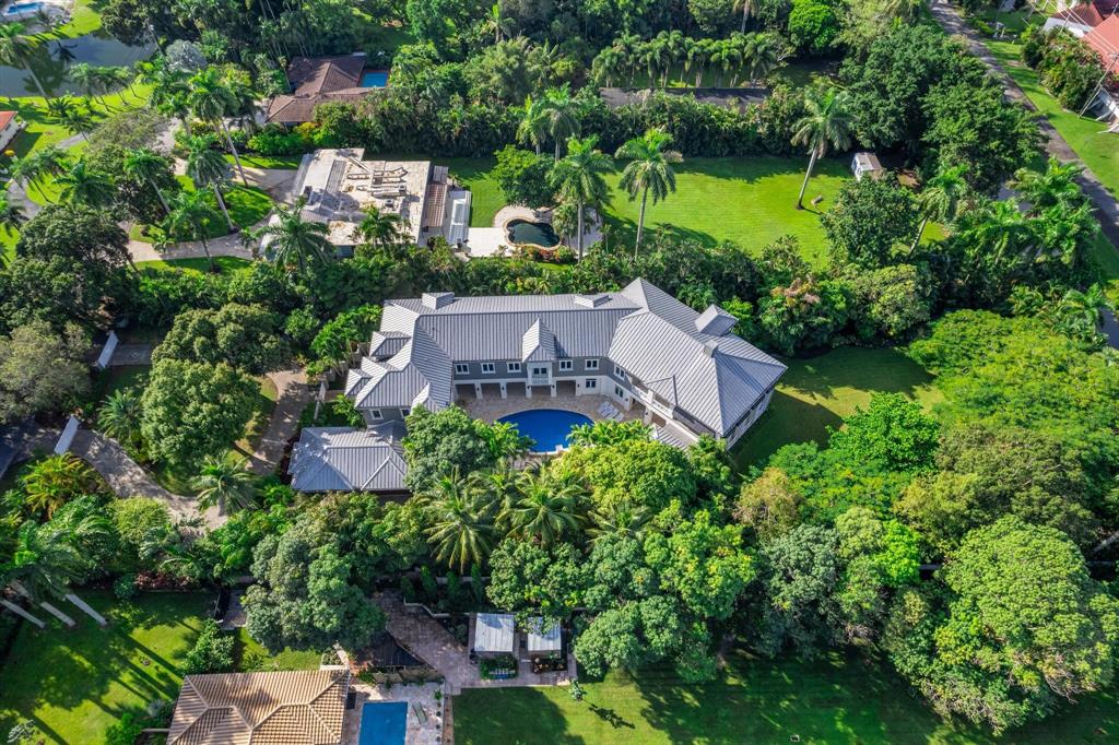101 Holly Lane Plantation, FL 33317 - Photo 5 of 59 an aerial view of a house with a garden and lake view