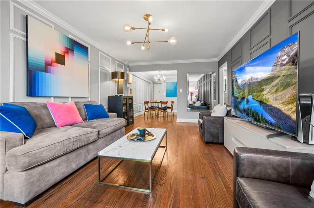 40 89th Street, Unit 5A Brooklyn, NY 11209 - Photo 11 of 16 a living room with furniture and a flat screen tv