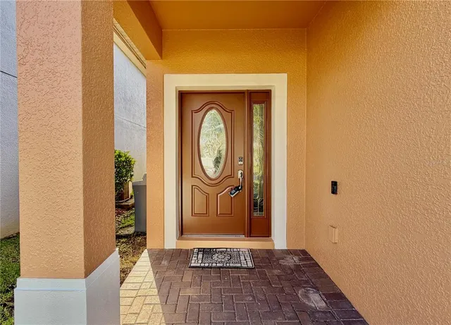 a view of an empty room and a window