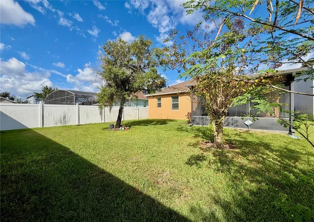 a view of room with a ceiling fan and hardwood floor