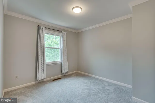 an empty room with a empty space and a window