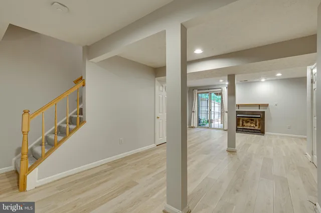 a view of an entryway with wooden floor