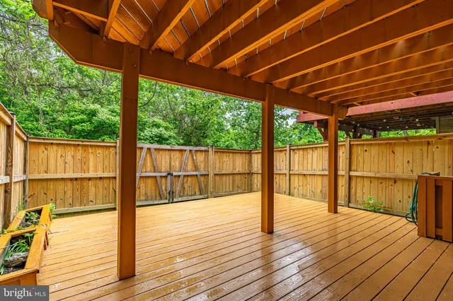 a view of a balcony with wooden floor