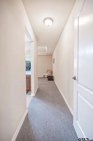 a spacious bathroom with a granite countertop sink a mirror and a vanity