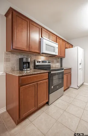 a kitchen with cabinets a sink and dishwasher